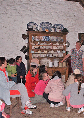 Children listening to the Mná an Tí